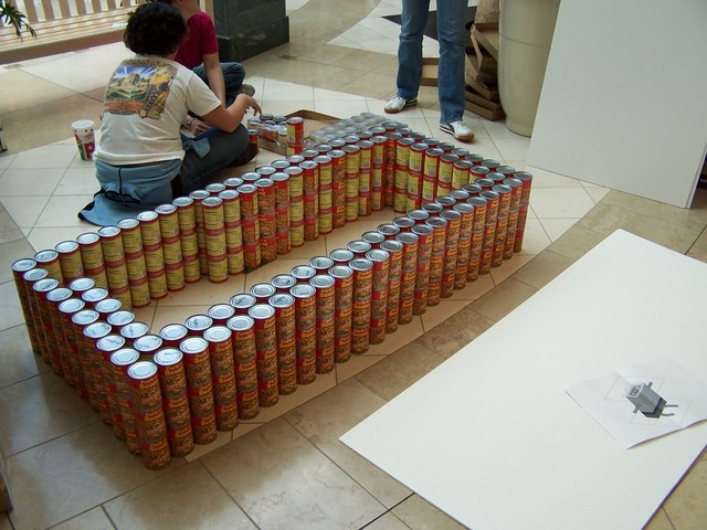 12 Hundreds of cans, unmoving teens on floor.jpg
